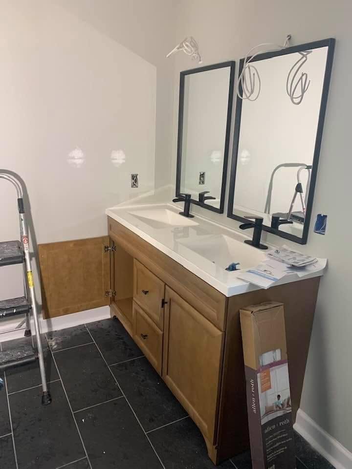 Finished double vanity with new sinks and matte black faucets installed